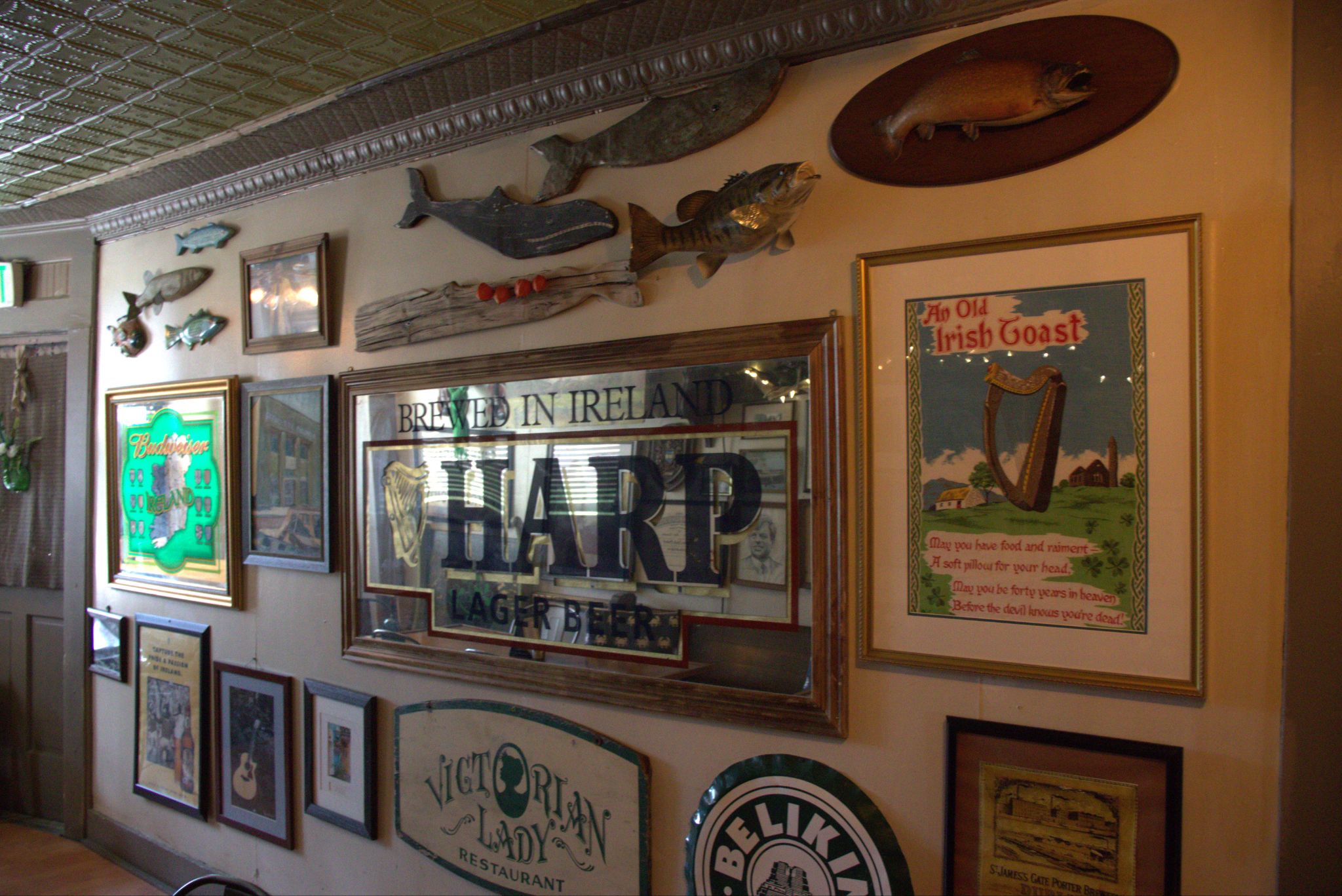 Harp Lager artwork and Irish pub memorabilia inside the pub